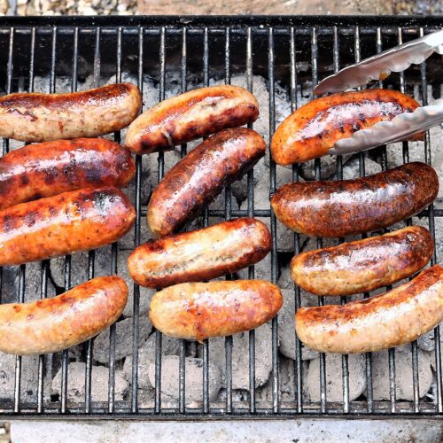 Wescountry sausages sizzling on a BBQ